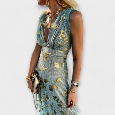 Vestido fluido con escote en V y detalles de lentejuelas